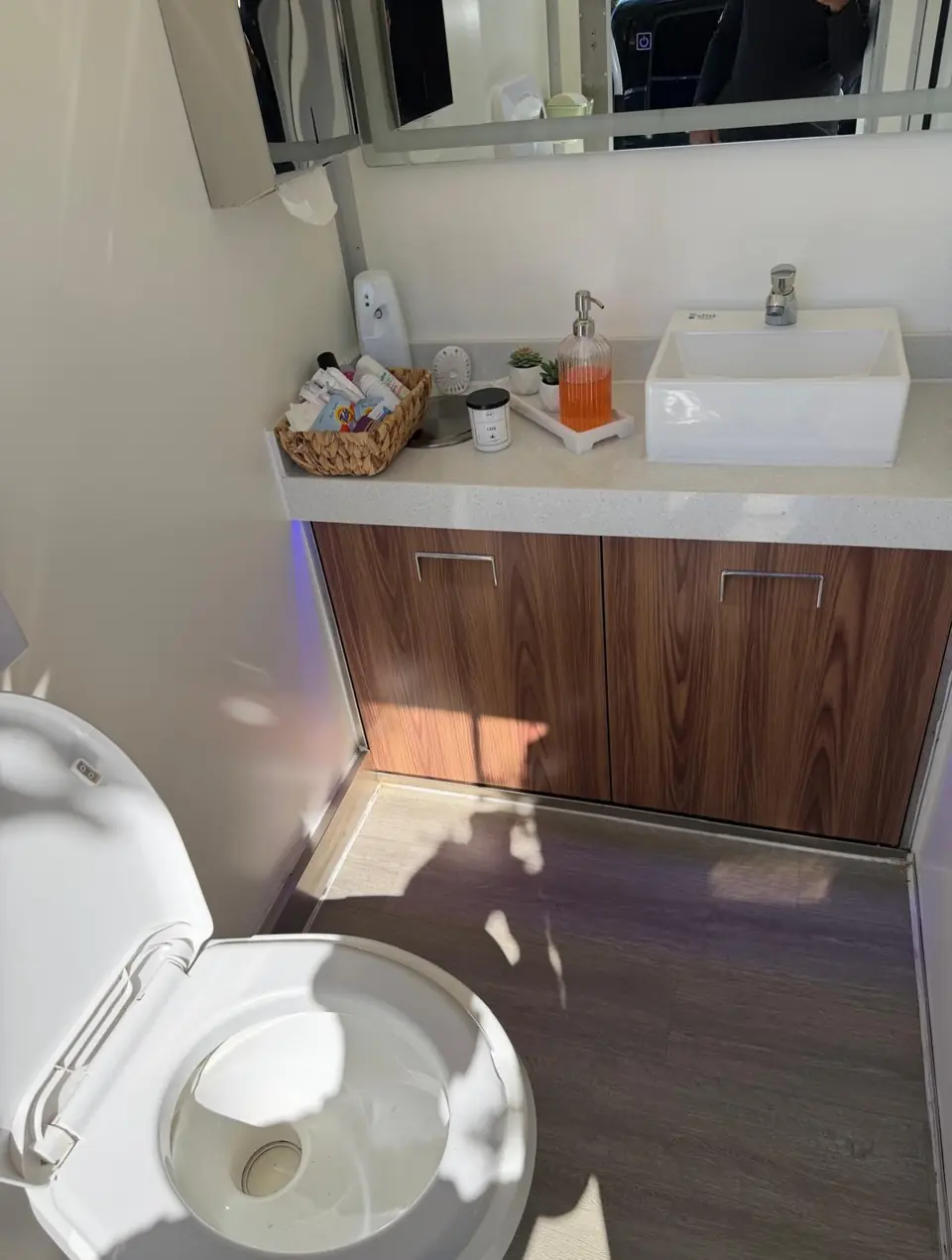 Vanity and mirror inside a restroom trailer